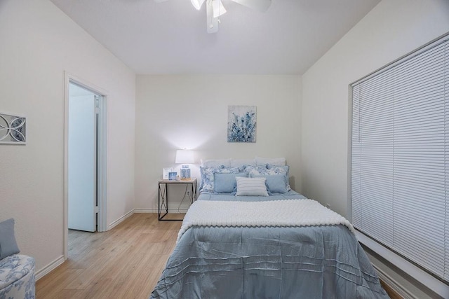 bedroom featuring ceiling fan and light wood-type flooring