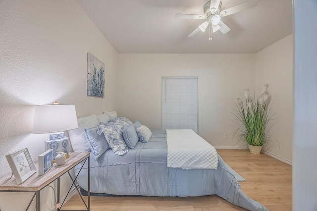 bedroom featuring ceiling fan and light hardwood / wood-style floors