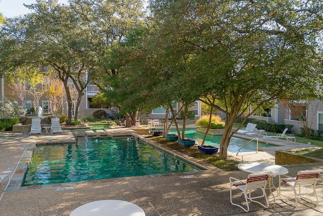 view of pool featuring a patio