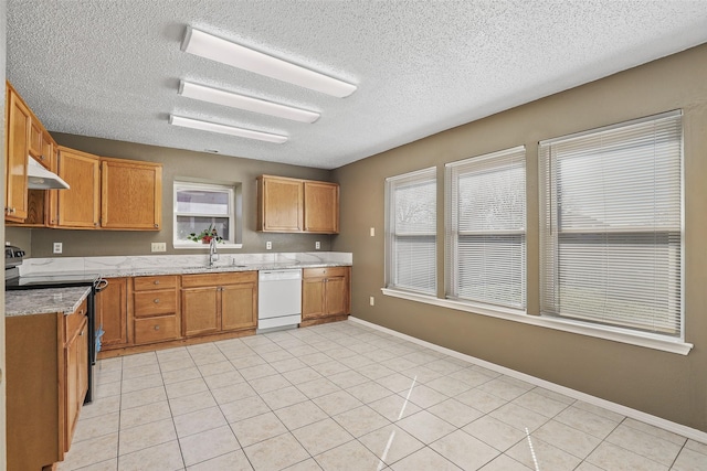 kitchen featuring electric stove, sink, white dishwasher, a textured ceiling, and light tile patterned floors