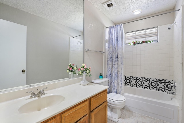 full bathroom with toilet, vanity, tile patterned flooring, shower / tub combo, and a textured ceiling