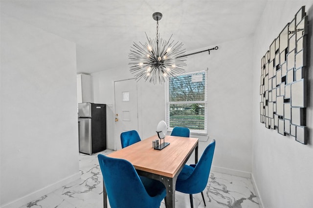 dining area featuring an inviting chandelier