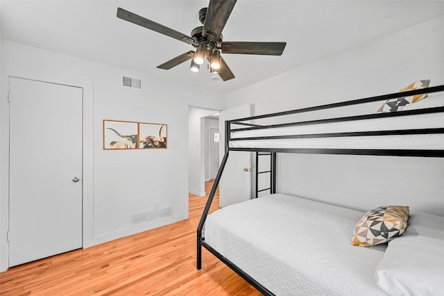 bedroom with ceiling fan and hardwood / wood-style floors