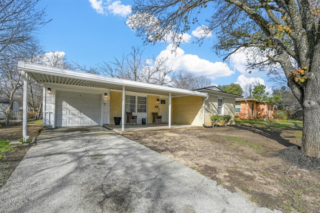 single story home featuring a carport and a garage