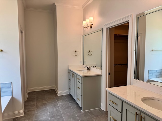 686 Newburyport St, Blanchard, LA 71107 - bathroom with two vanities, crown molding, baseboards, a spacious closet, and a tub