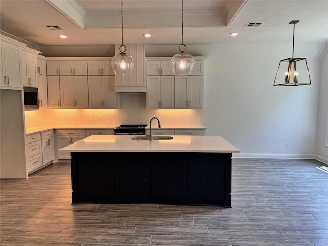 686 Newburyport St, Blanchard, LA 71107 - kitchen featuring ornamental molding, a tray ceiling, a sink, decorative backsplash, and recessed lighting