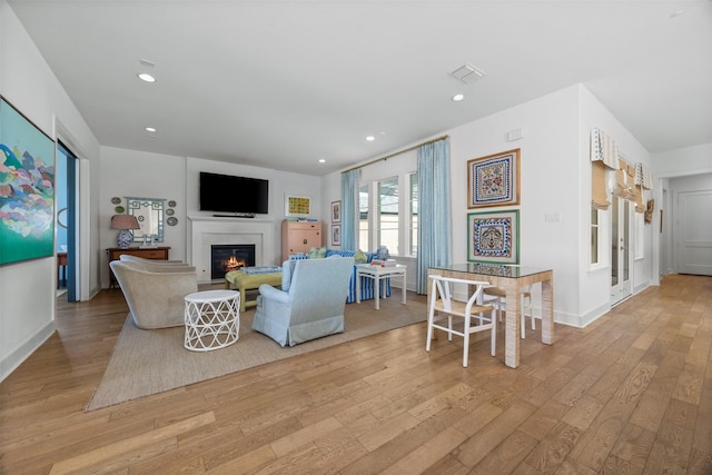 living room with light hardwood / wood-style flooring