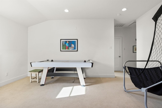 carpeted office space with vaulted ceiling