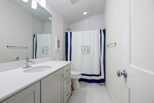 bathroom with toilet, vanity, lofted ceiling, and a shower with curtain