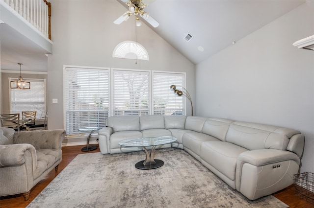 living room featuring ceiling fan, hardwood / wood-style floors, and high vaulted ceiling