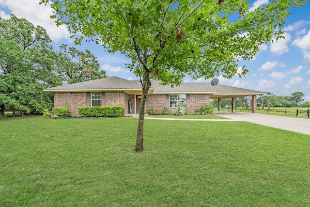 single story home with a carport and a front lawn