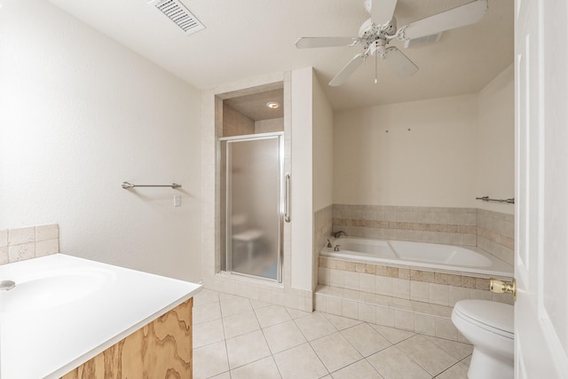 full bathroom featuring tile patterned flooring, ceiling fan, toilet, separate shower and tub, and vanity