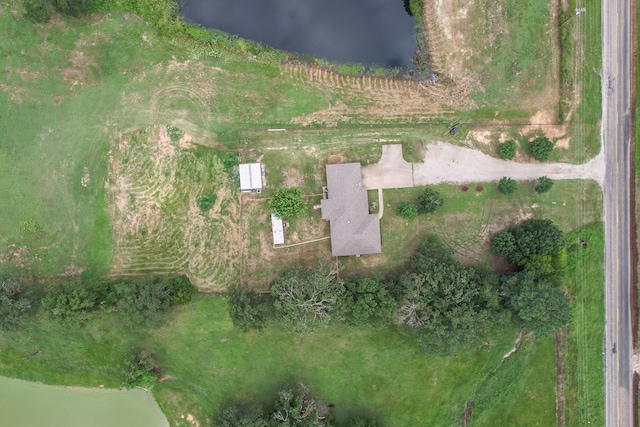 birds eye view of property featuring a water view and a rural view