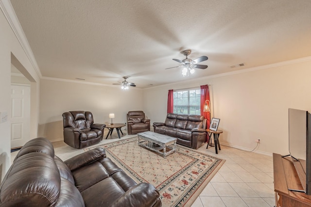 tiled living room featuring a textured ceiling, ceiling fan, and crown molding