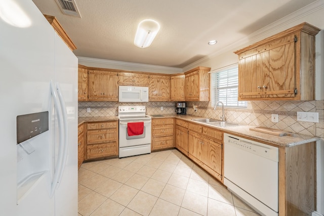 kitchen with white appliances, crown molding, sink, and light tile patterned floors