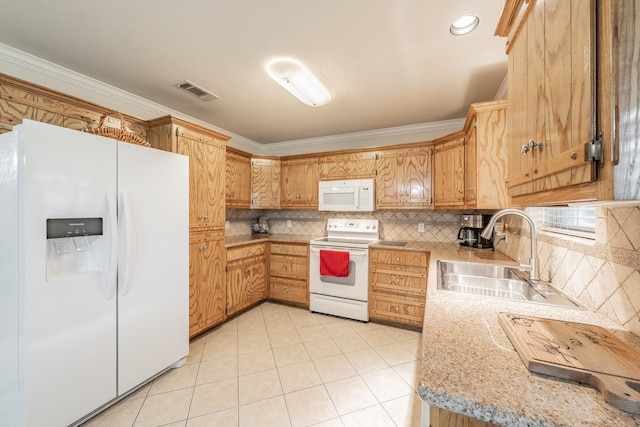 kitchen with sink, white appliances, light tile patterned floors, and crown molding