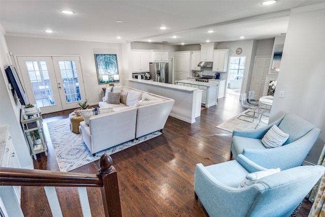 living room with french doors, dark hardwood / wood-style flooring, and crown molding