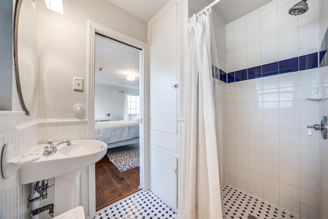 bathroom with sink and a shower with shower curtain