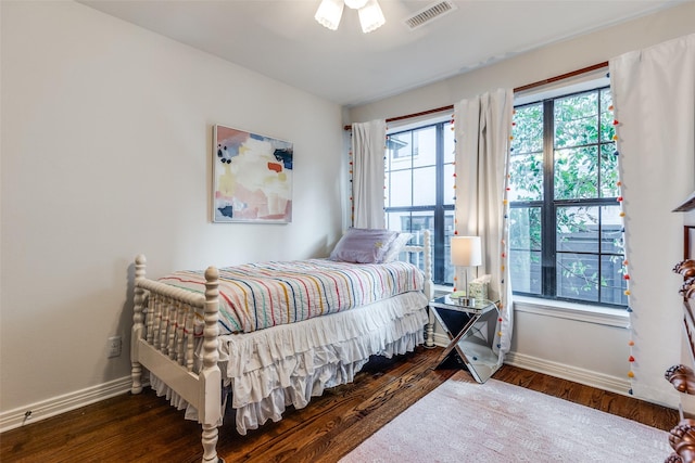 bedroom featuring ceiling fan and dark hardwood / wood-style flooring