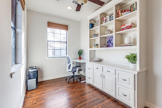 home office featuring ceiling fan and dark wood-type flooring