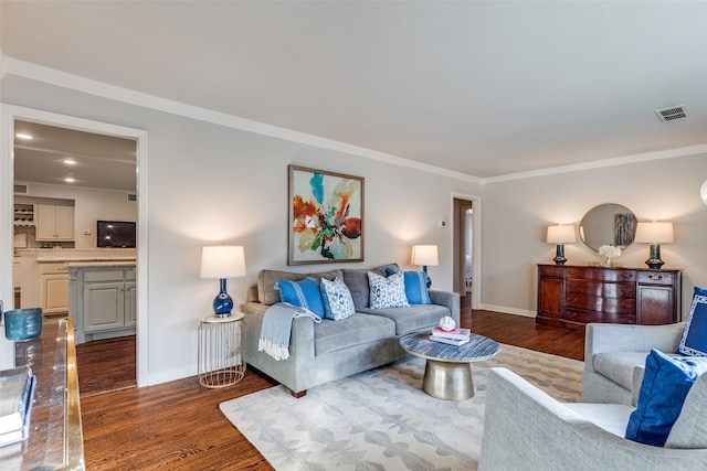 living room featuring ornamental molding and dark hardwood / wood-style floors