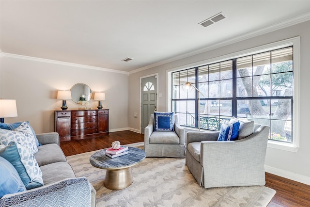 living room with hardwood / wood-style floors and crown molding