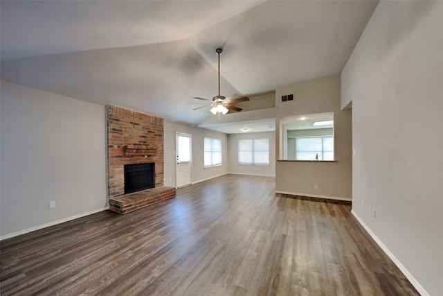 unfurnished living room with ceiling fan, hardwood / wood-style floors, lofted ceiling, and a fireplace