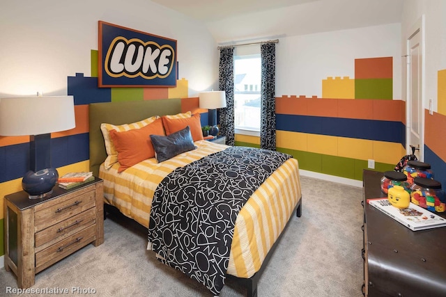 carpeted bedroom with lofted ceiling