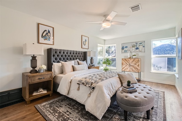 bedroom with ceiling fan and hardwood / wood-style floors