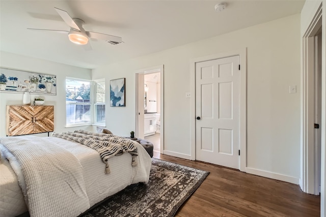 bedroom with ceiling fan, dark hardwood / wood-style flooring, and ensuite bathroom