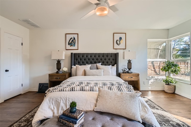 bedroom with ceiling fan and dark hardwood / wood-style floors