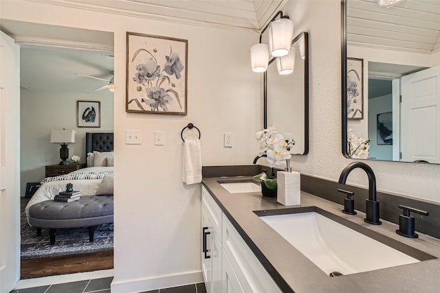 bathroom with vanity, lofted ceiling, tile patterned flooring, and ceiling fan