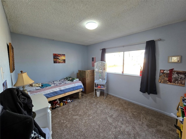 carpeted bedroom featuring a textured ceiling