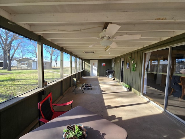 sunroom / solarium with ceiling fan