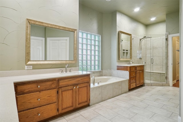 bathroom with vanity, tile patterned floors, and separate shower and tub