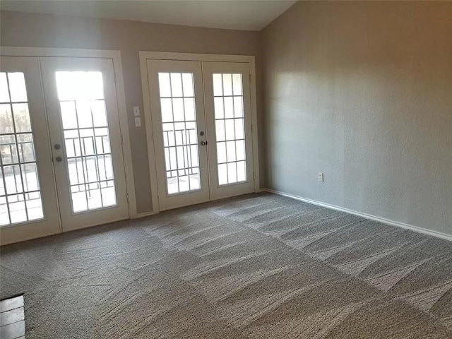 doorway to outside with a healthy amount of sunlight, french doors, and carpet flooring