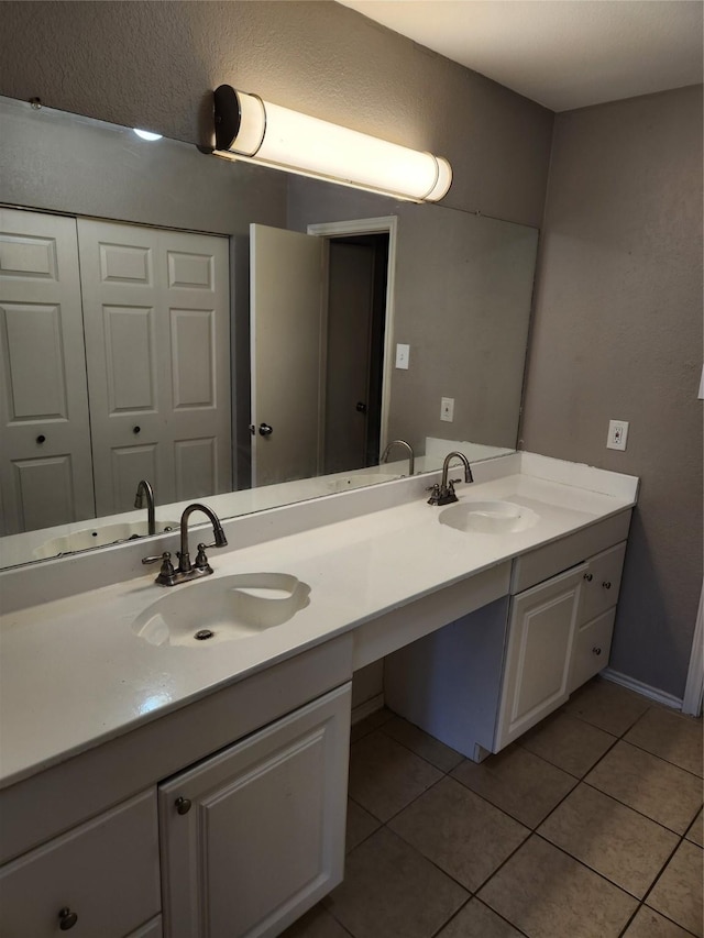 bathroom with vanity and tile patterned flooring