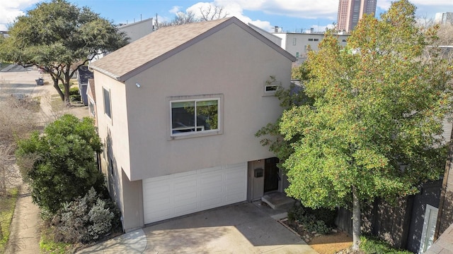 view of side of home with a garage