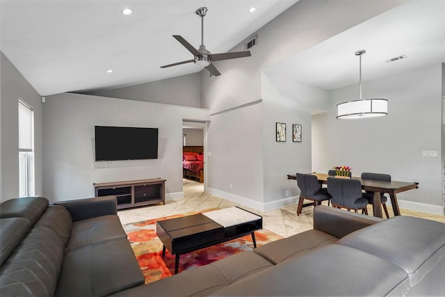 tiled living room with high vaulted ceiling and ceiling fan