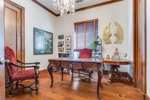 office space with ornamental molding, wood-type flooring, and a chandelier