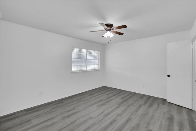 unfurnished room with ceiling fan and hardwood / wood-style floors