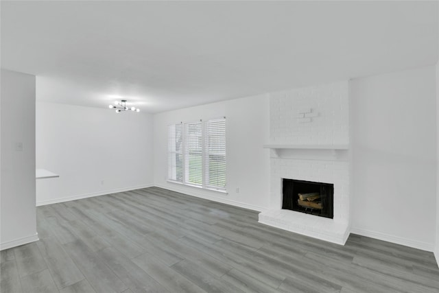 unfurnished living room with a fireplace and wood-type flooring