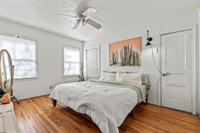 bedroom featuring hardwood / wood-style floors and ceiling fan