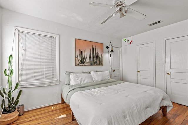 bedroom featuring ceiling fan and wood-type flooring