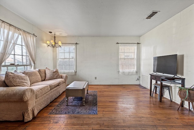 living room with dark hardwood / wood-style floors and a wealth of natural light