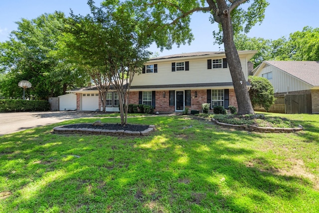 view of front of home featuring a front yard and a garage