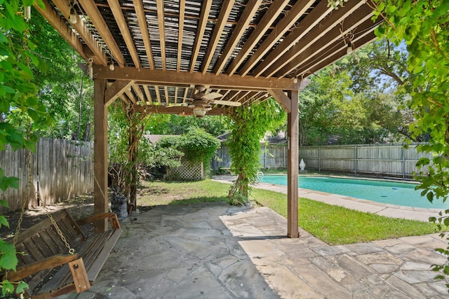 exterior space with ceiling fan, a pergola, and a fenced in pool