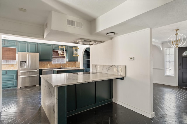 kitchen with kitchen peninsula, decorative light fixtures, stainless steel refrigerator with ice dispenser, decorative backsplash, and black electric stovetop