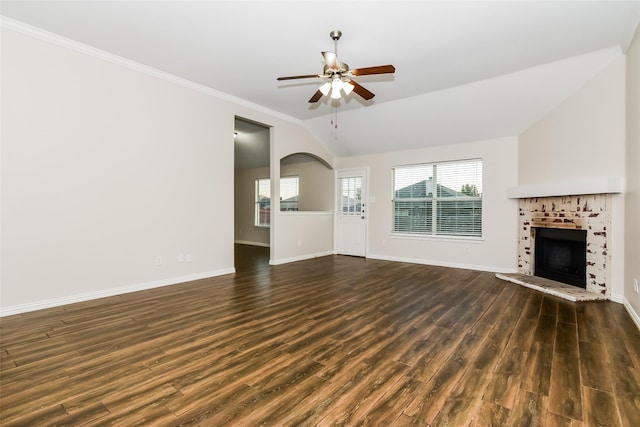 unfurnished living room featuring dark wood-type flooring, ceiling fan, vaulted ceiling, and ornamental molding