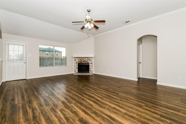 unfurnished living room with lofted ceiling, dark hardwood / wood-style flooring, ceiling fan, and crown molding